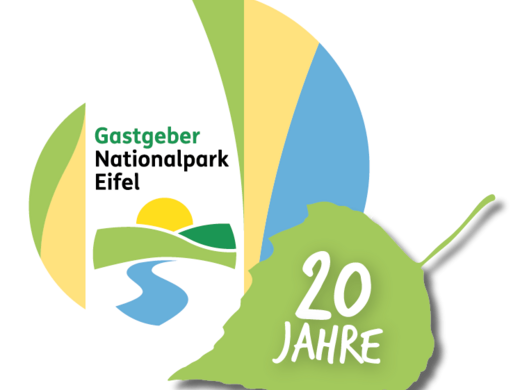 A holiday apartment in Schleiden-Gemünd at the national park Host National Park Eifel logo with green landscape symbol and 20 years lettering