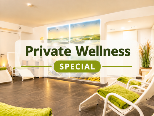 A holiday apartment in the Eifel region with a sauna and gym Private wellness area with loungers and green towels