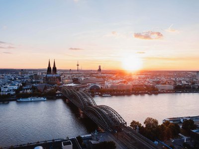Holiday in the Eifel region with kids: action guaranteed Sunset over Cologne with Rhine river, Hohenzollern Bridge, and Cologne Cathedral